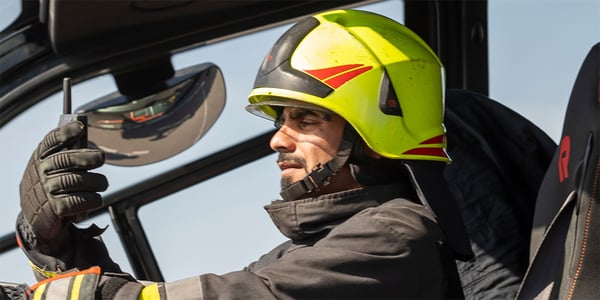 Firefighter-wears-gloves-and-uses-Tactilon-Dabat-inside-fire-truck-1000px-wide